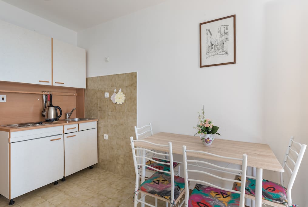 Full-on kitchen with fridge and stove