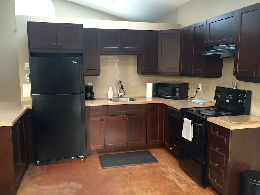 Fully stocked & functional kitchen, ready to use. All pots, pans, cups, plates, coffee machine, kettle, microwave, and utensils are provided.