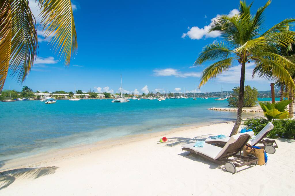 Take in the breeze and sun from your own private beach loungers.