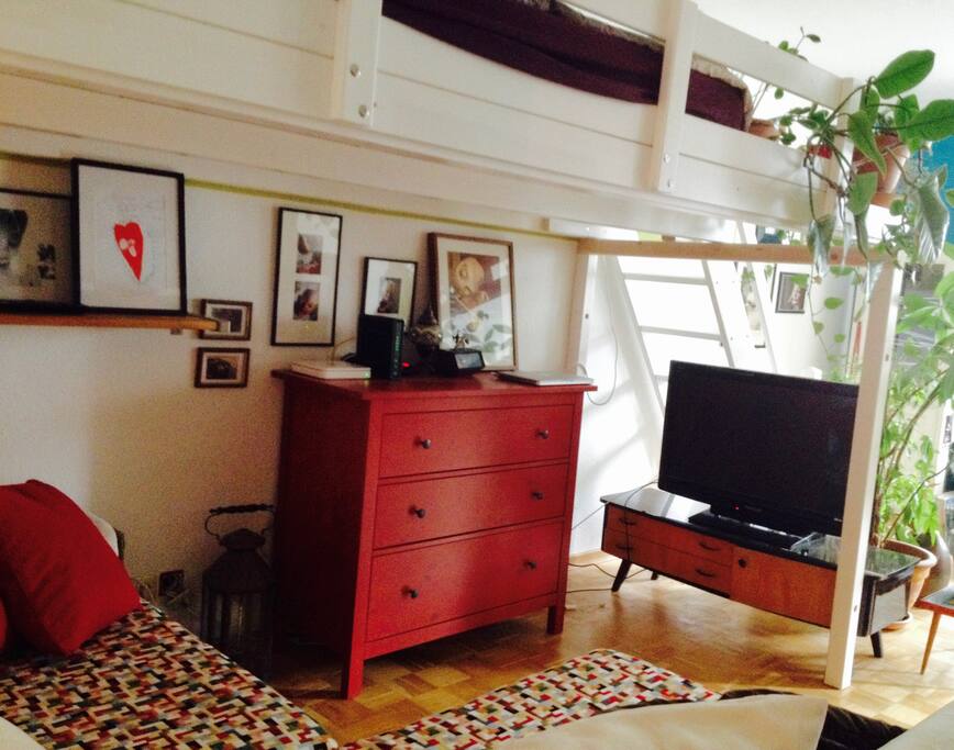 Living room with TV corner and a comfortable loft bed for 2 people