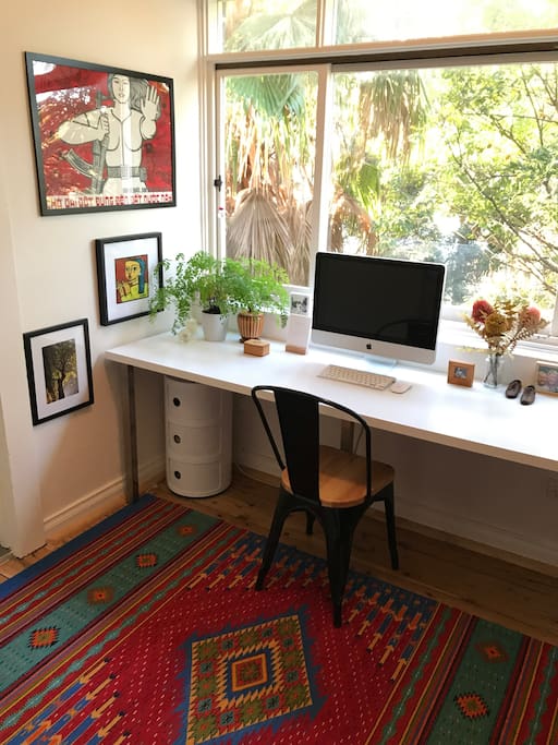 Light filled study with leafy outlook