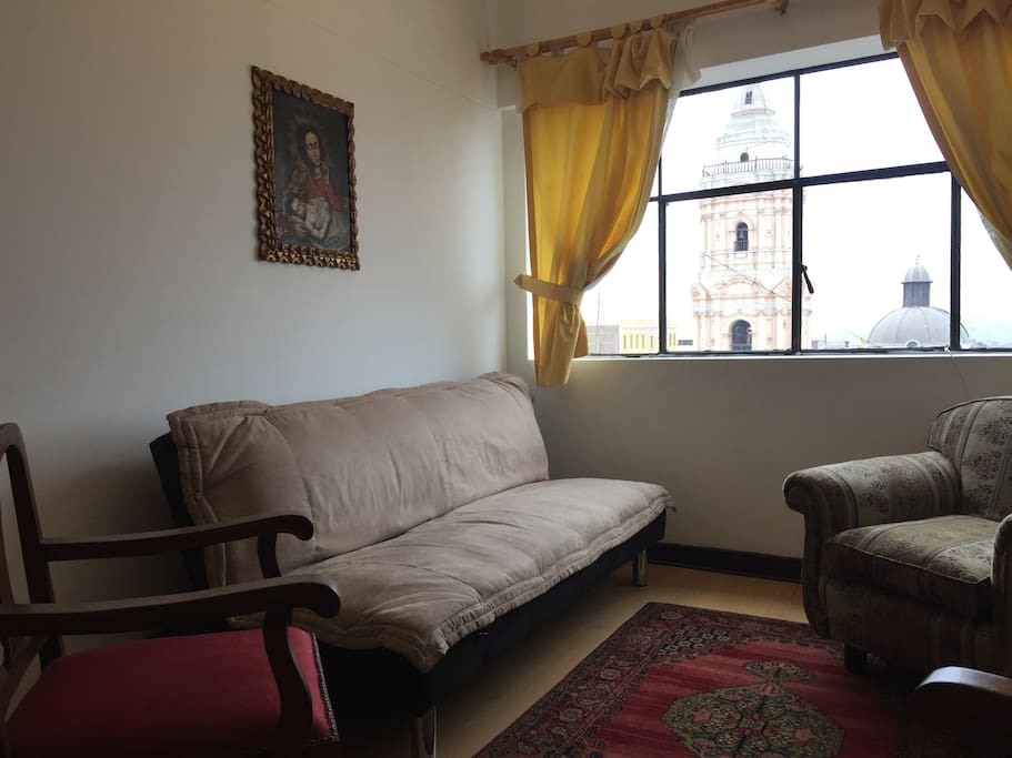 Comfortable living room with unbeatable view of the belfry of the Santo Domingo Church.