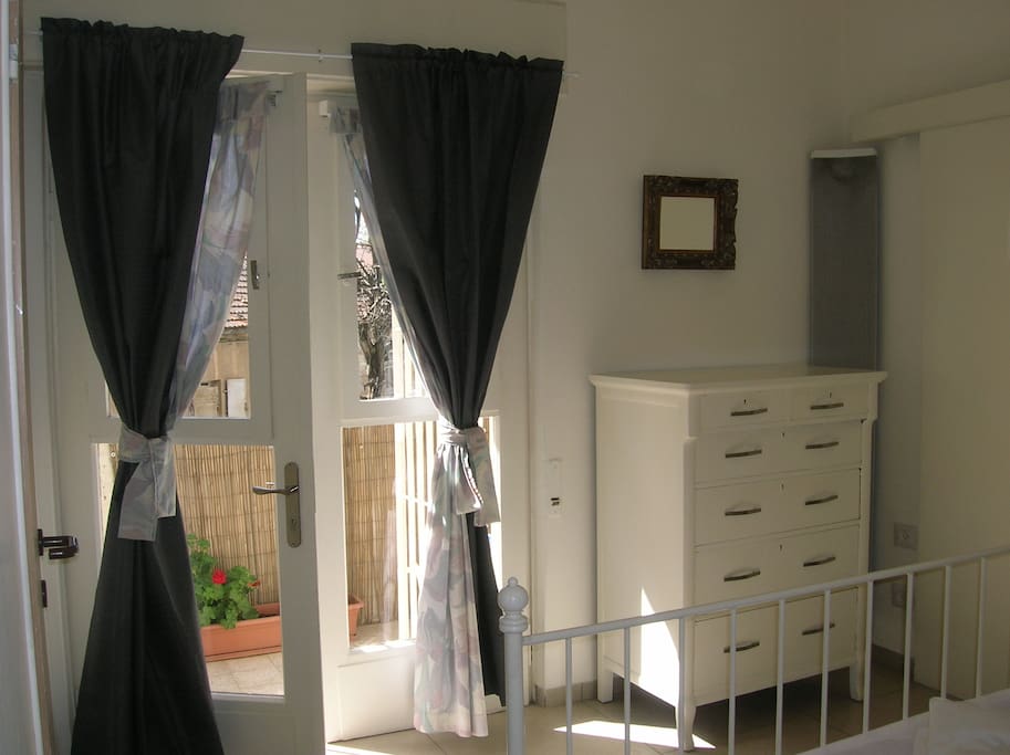French doors to balcony from bedroom. Black out curtains ensure you sleep well!