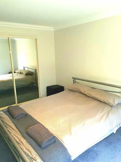 Queen size bed and new bedding..