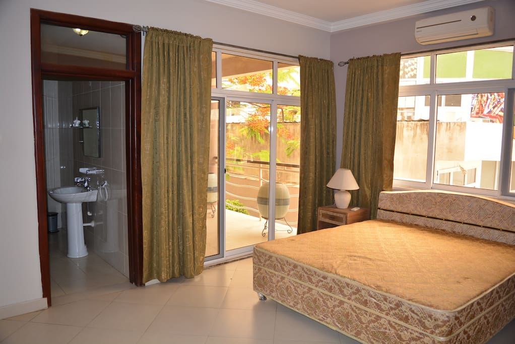 Your bedroom is full of light, with balcony overlooking garden and poolside.