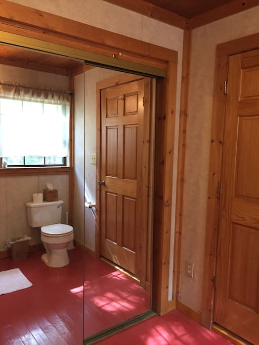 Bathroom has large stocked closet