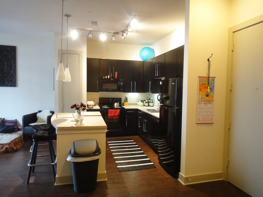 loaded kitchen with island and open space to relax