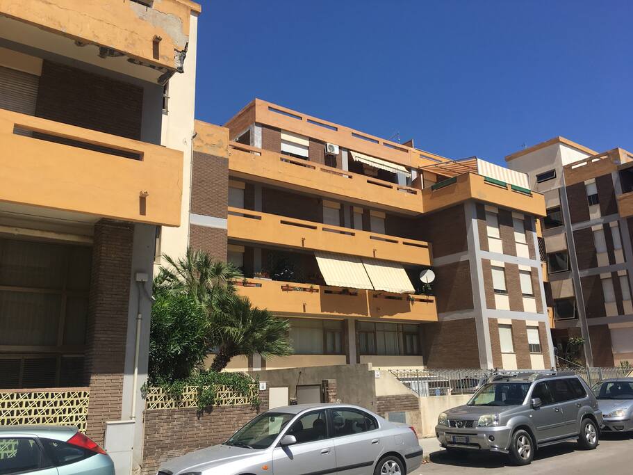 external view of apartment complex showing top floor penthouse