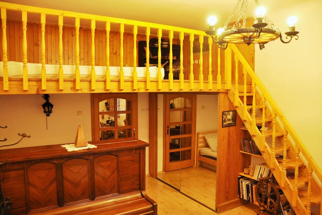 Wooden stairs and loft is adding warm feeling