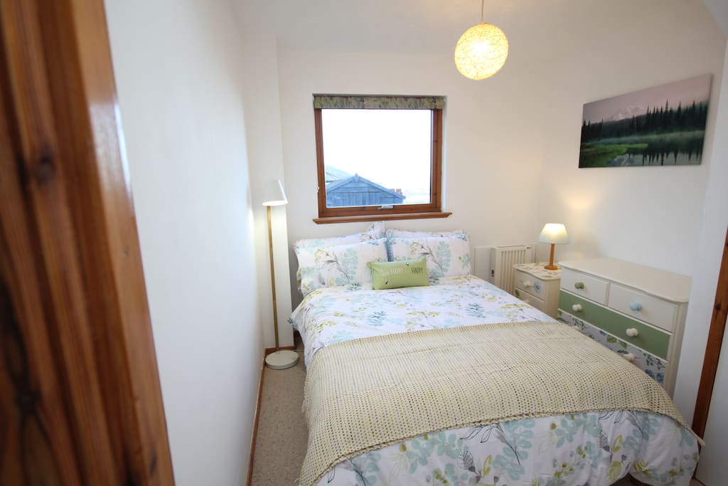Double Bedroom in a day light. Window with Kessock Bridge view