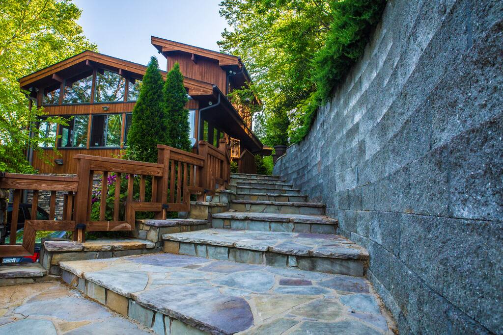 Large blue stone steps approaching home entrance
