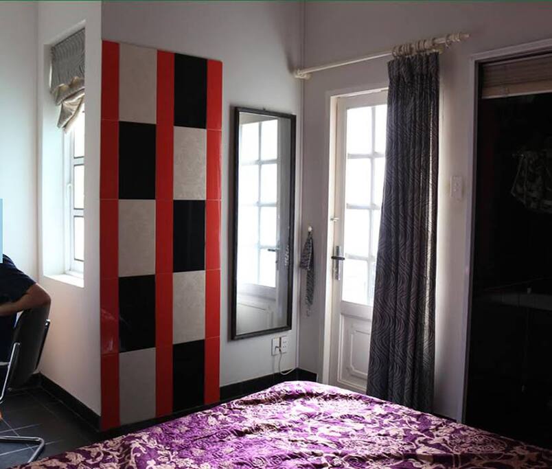 Bedroom with door to balcony