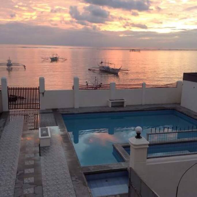 View of the pool and the sunset from the terrace...