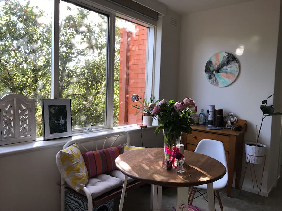 The apartment is filled with natural light from the large windows