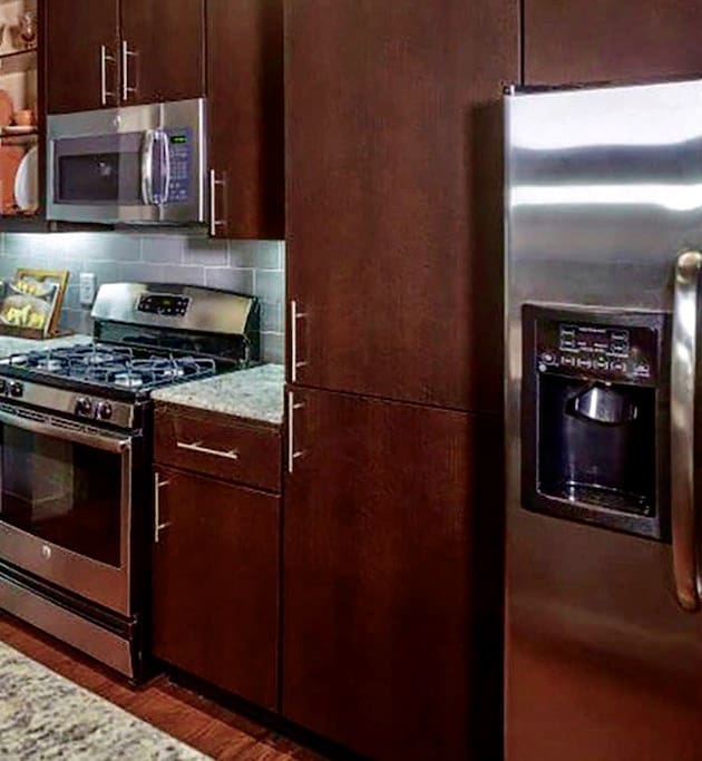 Large fully furnished & equipped Chef Kitchen with gas stove top for cooking.