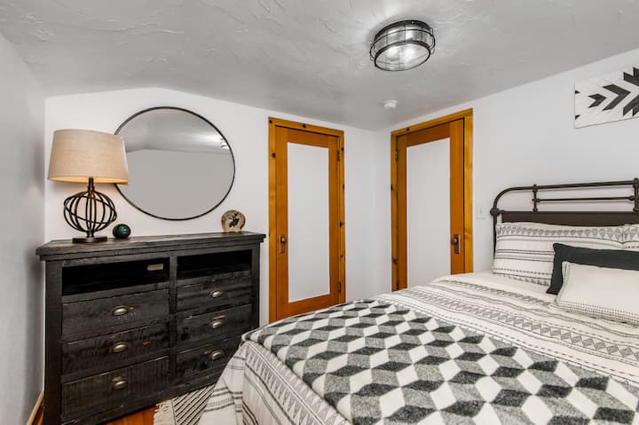 Bedroom #2 (Upper Level): Bedroom features TV, dresser, and 1 queen bed.