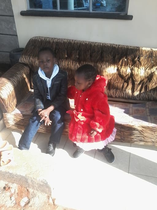 My children relaxing outside the house on the front face