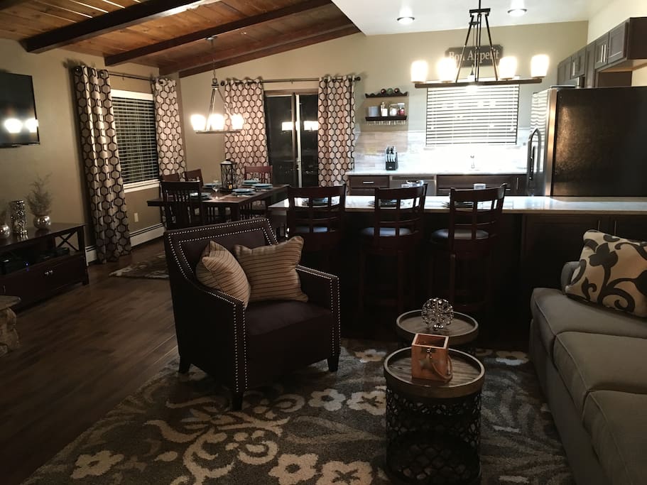 Beautiful great room with new flooring, and comfortable furnishing