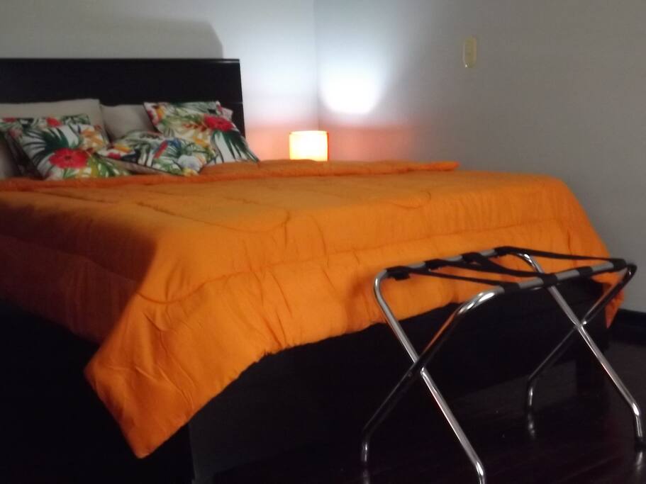 Room with queen size bed. The mattress is awesome!