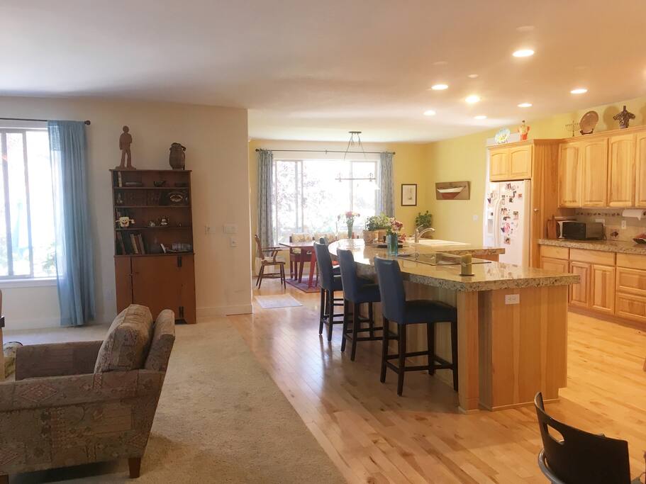 Open floor plan: first floor kitchen, living room, dining room.