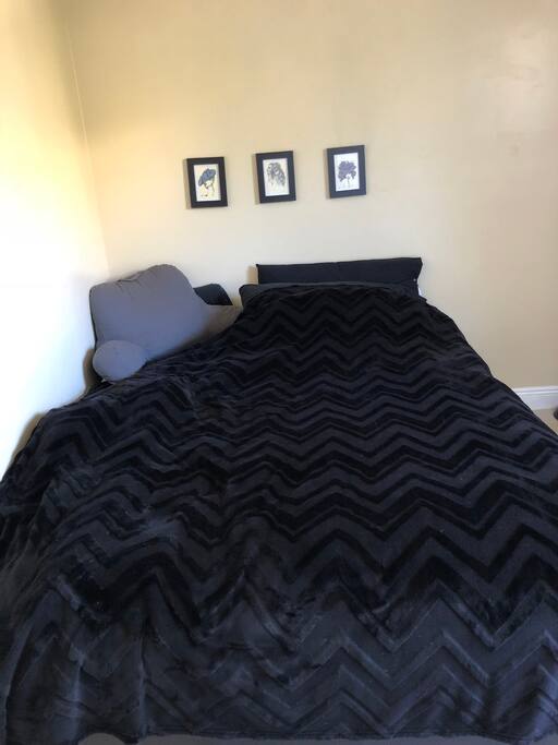 Queen size bed with duvet cover.
