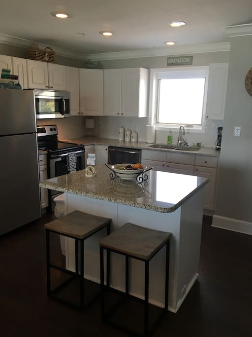 Very well-equipped kitchen with center island-- all granite countertops and stainless steel appliances