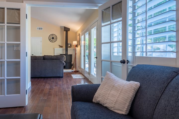 French Doors open or close between Living Room and Den with TV
