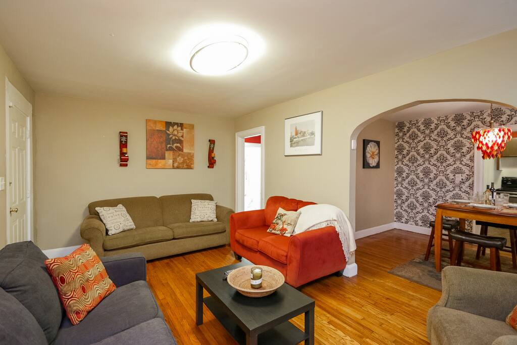 The living room has a range of comfortable seating for the group with a 52” Samsung TV