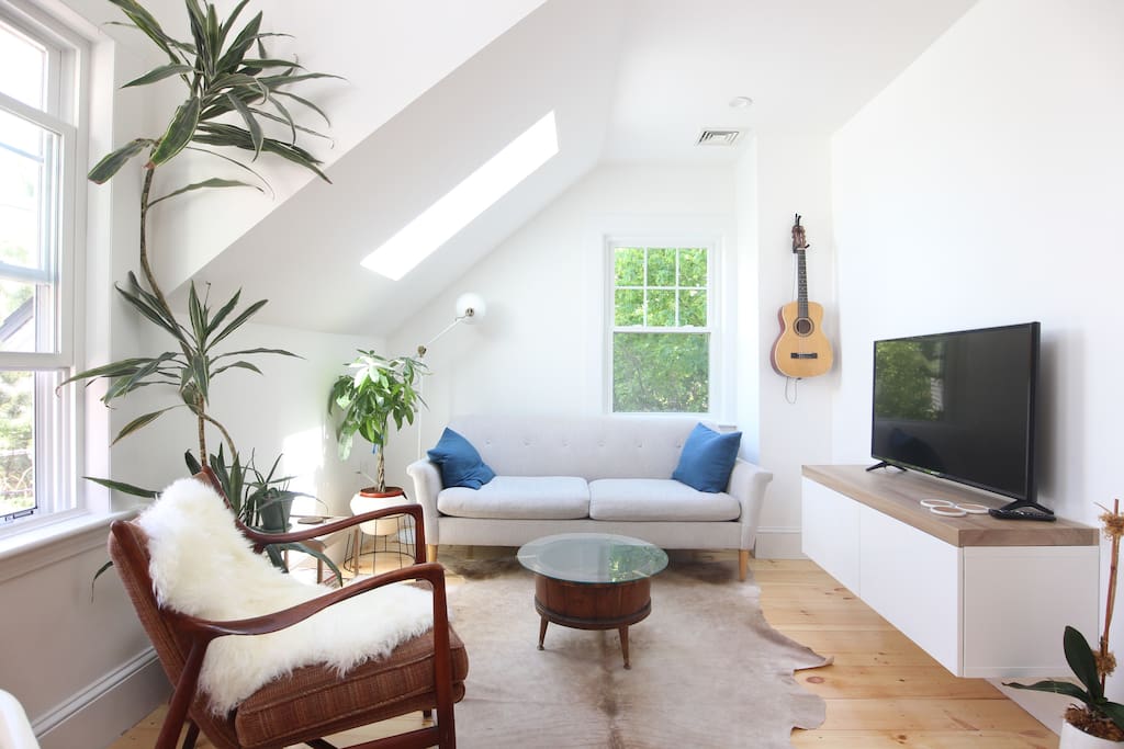 Bask in a sunny morning, binge some Netflix or read in the airy living room