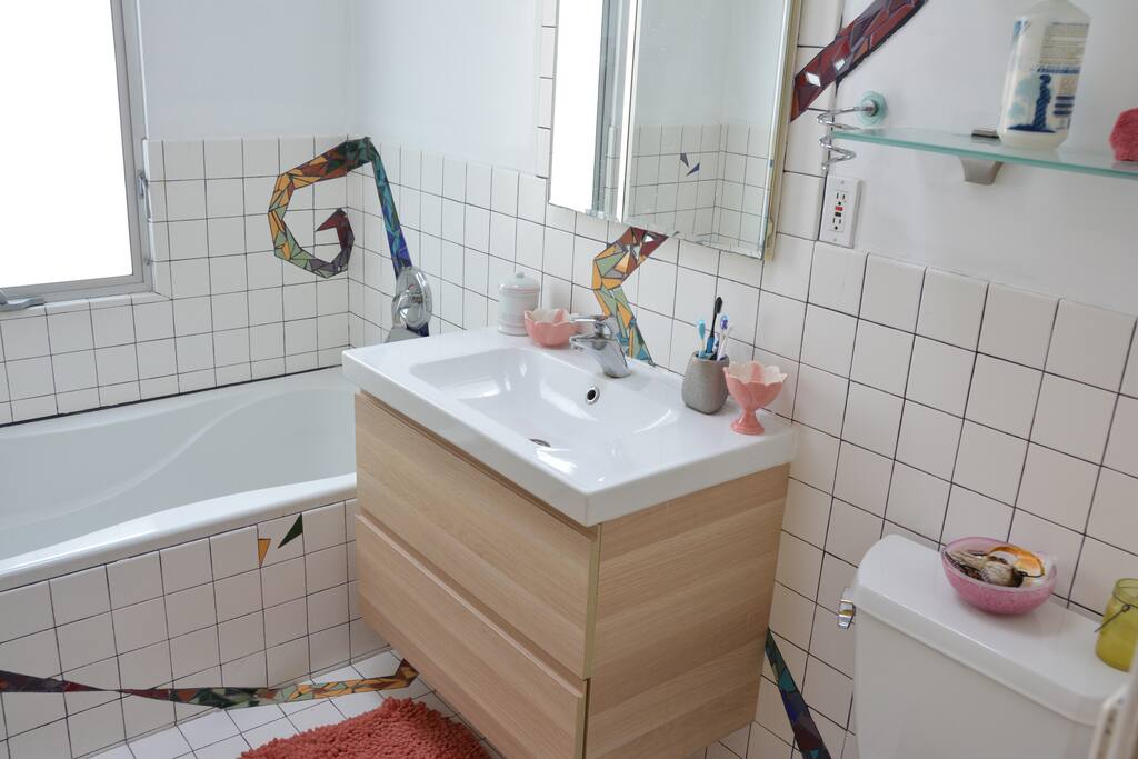 Mosaic bathroom with huge tub and walk in shower