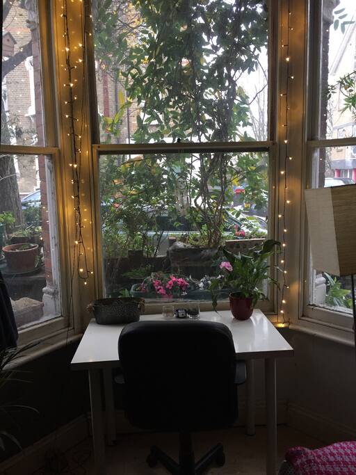 Window and desk where you can see the canal across the street