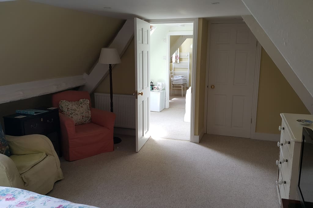 The attic room and landing leading to the bathroom