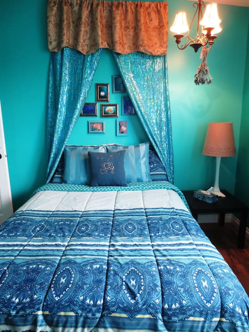 Your room with mermaid themed decor comes with a double bed, desk and seating for two