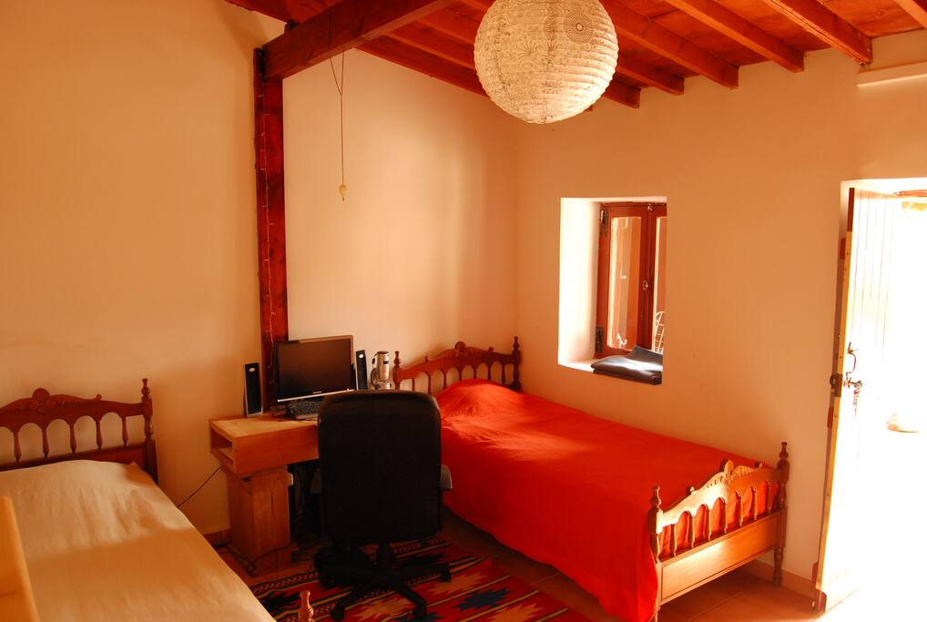 two singles beds at the first bedroom