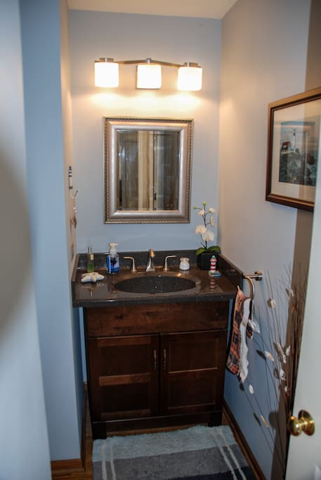 Half right across from bedroom. Full bath also available for showers.