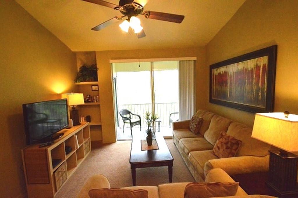 Living room with sliding glass doors to the balcony