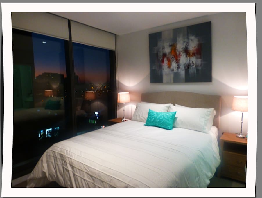 Bedroom 1 with view of sunset
