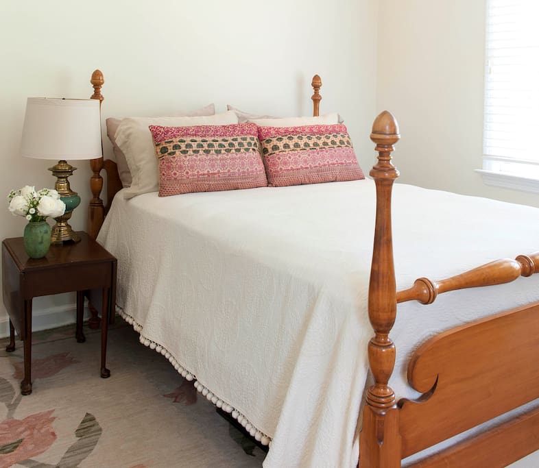 A four-poster bed is a perfect retreat after a busy day in Charleston.