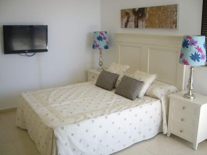 Delightful Master Bedroom furnished to a very high standard with Private Balcony, Sea & island Views