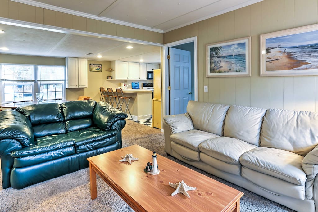 After a long day of traveling, sit back and relax on the 2 leather couches.