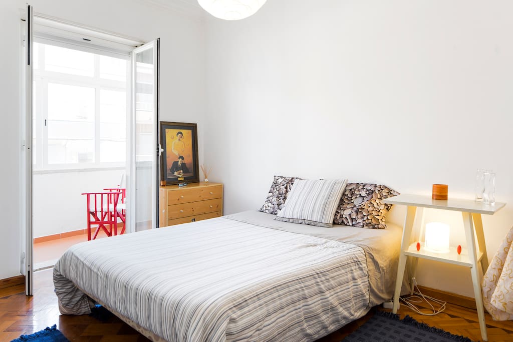 Bedroom 1 with large double bed and lots of daylight