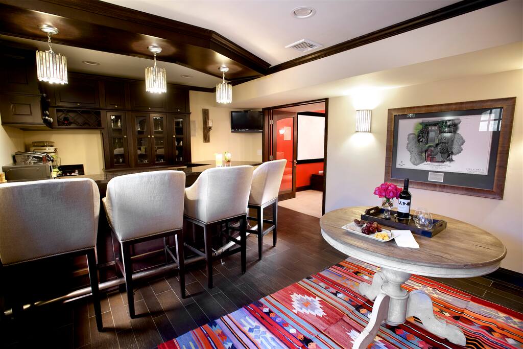 The living space complete with a custom built bar area. Do you love music? The Burrow has a state of the art sound system that you can operate from the Ipad's on the wall. Play music in the bar, living space, bedroom, gym, bluestone patio and pool area!