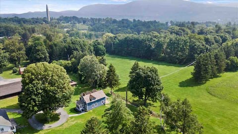 1865 Farm House with mountain and meadow views.