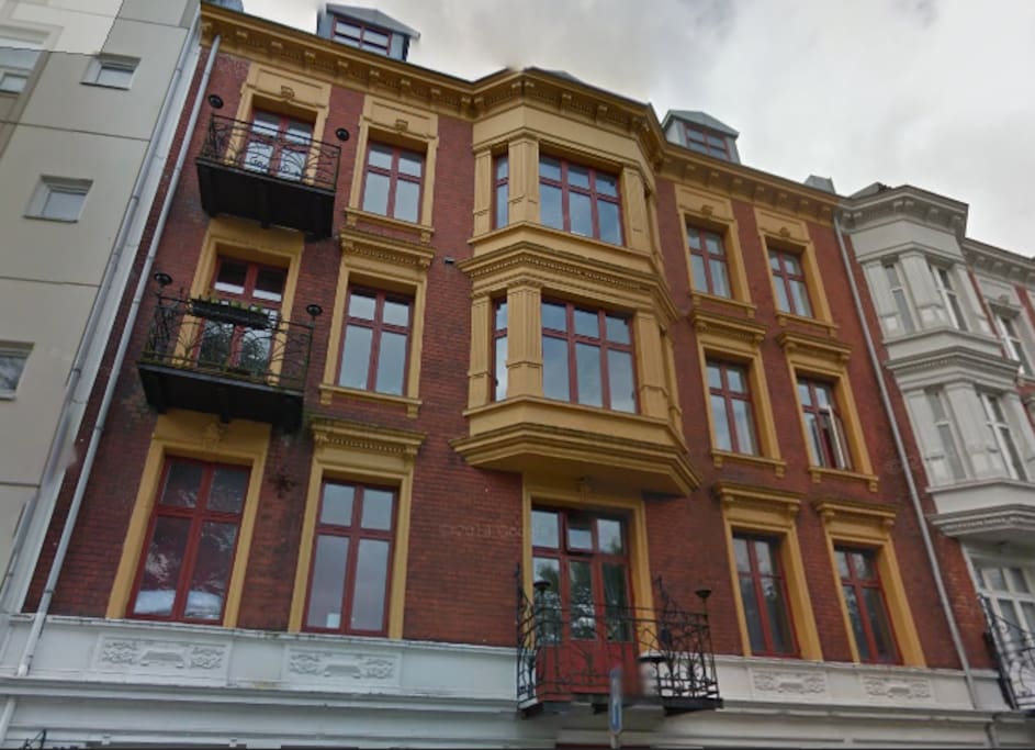The room is in one of the top windows in the roof