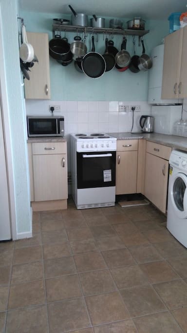kitchen has variety of cooking pots