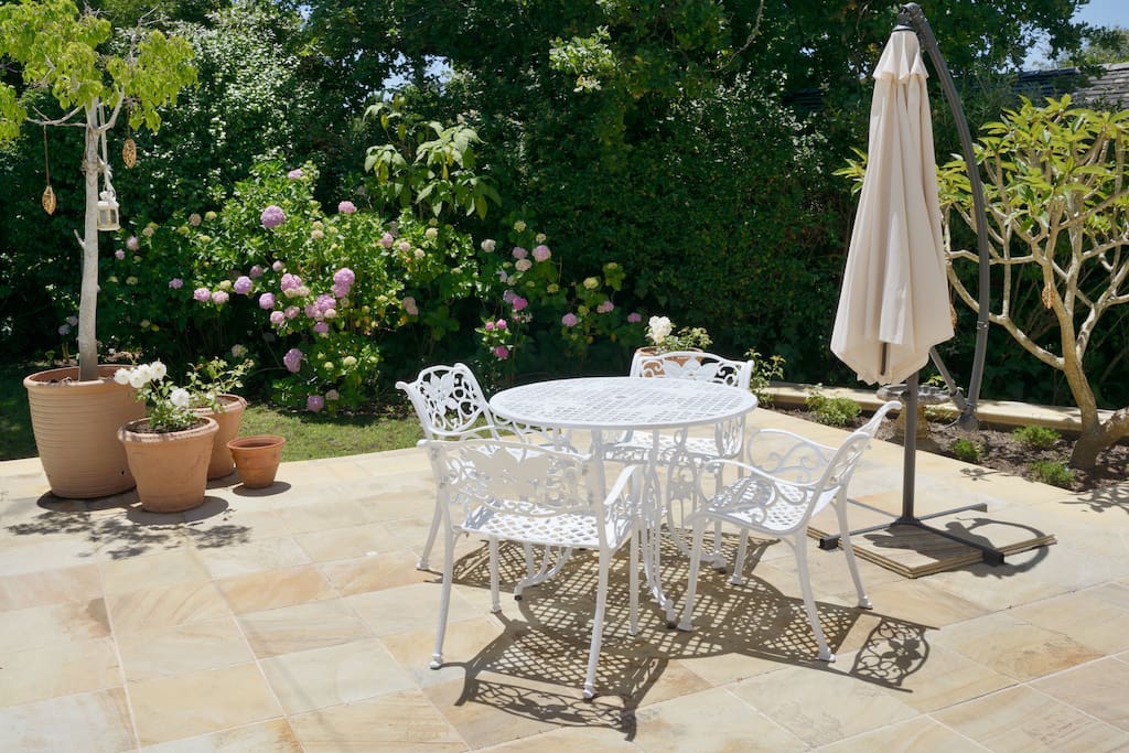 Gorgeous wrought iron table and chairs alongside the pool for having breakfast or enjoying drinks outside