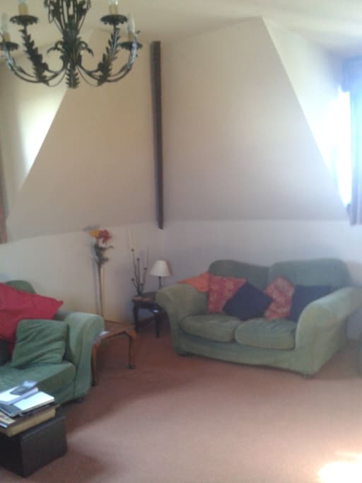 The sitting room is upstairs, to appreciate the amazing view; distant sea views of St Ives and rolling countryside in between