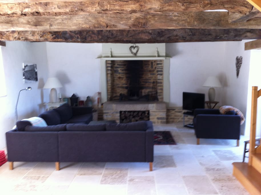 Living area with large open fireplace