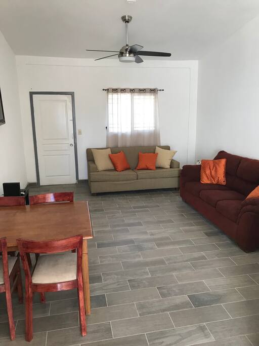 Living room with sofa bed, couch and dinning table