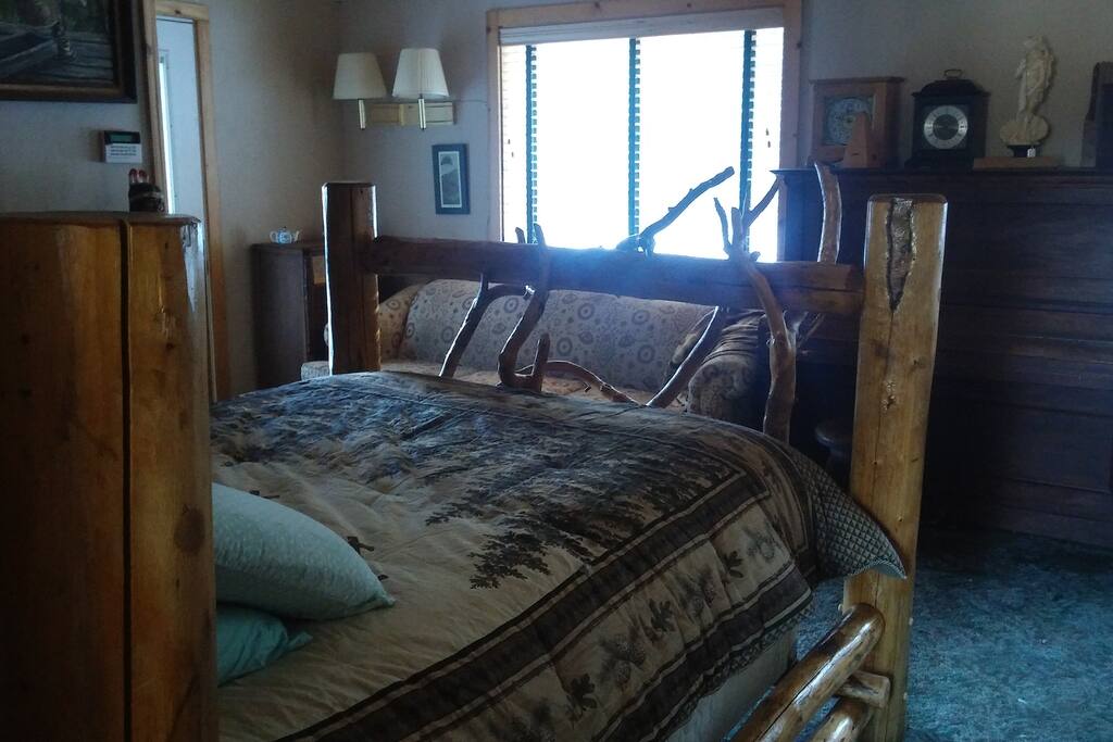 Master room, our largest room with a queen sized bed and couch. Couch can sleep another guest if you desire. This room has its own private entrance with attached bathroom and microwave. We also have an adjacent room with two twin beds and private bathroom available. Book one or both rooms.